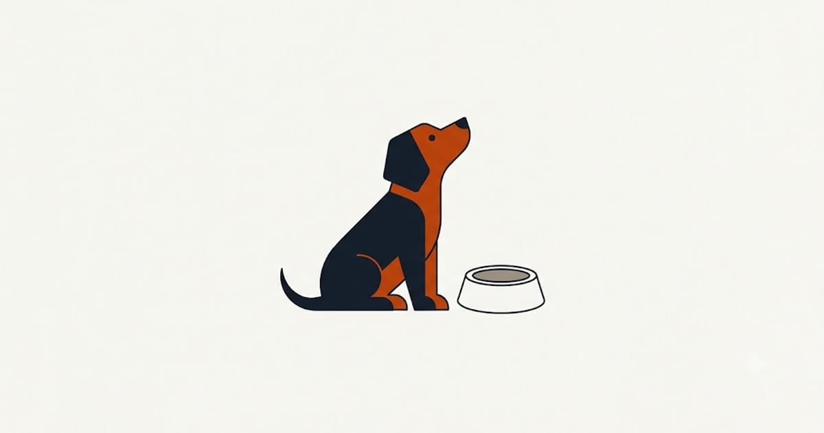 A puppy waiting beside an empty bowl